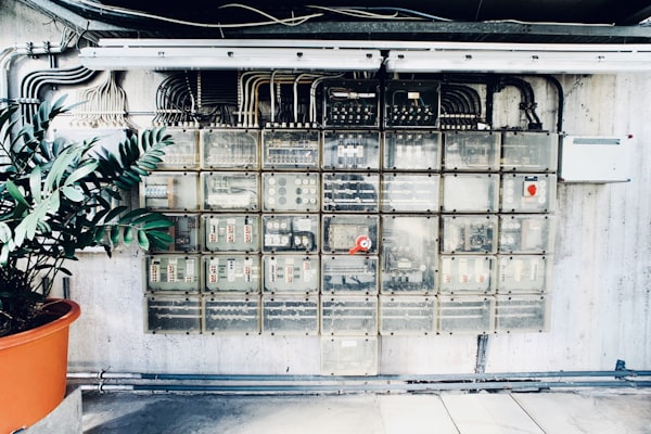 Wall-mounted breaker panel installation with labeled circuits